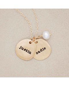 Beloved name disc handcrafted in 14k yellow gold hung with a vintage freshwater pearl and customizable with a name or word along with other sterling silver jewelry