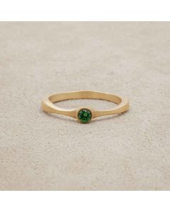 Bezel birthstone ring handcrafted in 14k yellow gold set with a 3mm birthstone inside a gold bezel