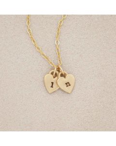 Cherished hearts initials necklace handcrafted in 14k yellow gold including two customizable charms
