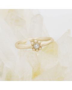 Forever flower wedding ring hand-molded and cast in 10k yellow gold set with a 3mm birthstone or diamond