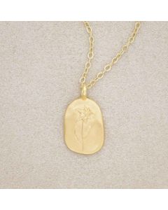 gold plated March birth flower necklace with an 18" gold filled link chain, on beige background