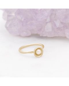 Nesting freshwater small pearl ring hand cast in 14k yellow gold holding inside a small 4mm freshwater pearl 