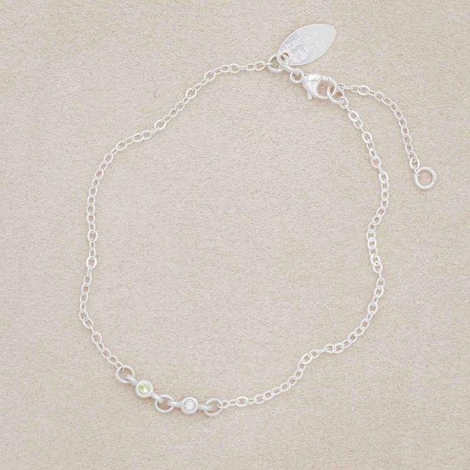 sterling silver Dainty Finespun Birthstone Bracelet - Small, 2mm personalized birthstones, on a beige background