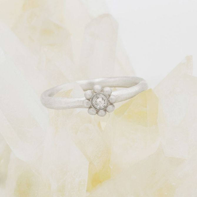 Forever flower wedding ring hand-molded and cast in sterling silver set with a 3mm birthstone or diamond