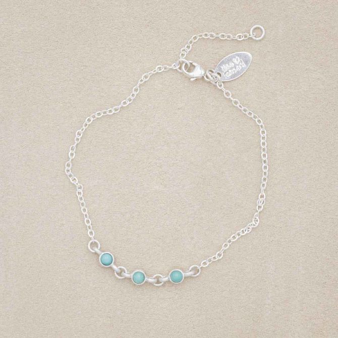 sterling silver Lighthearted Turquoise Bracelet on a beige background