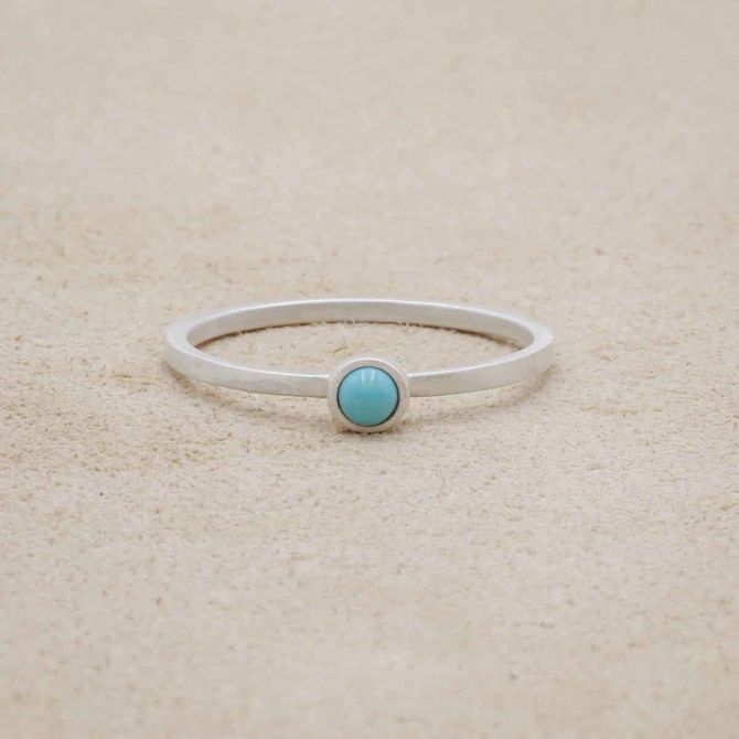 sterling silver Lighthearted Turquoise Ring on beige background
