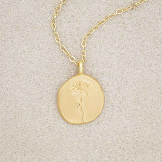 gold plated November birth flower necklace with an 18" gold filled link chain, on beige background