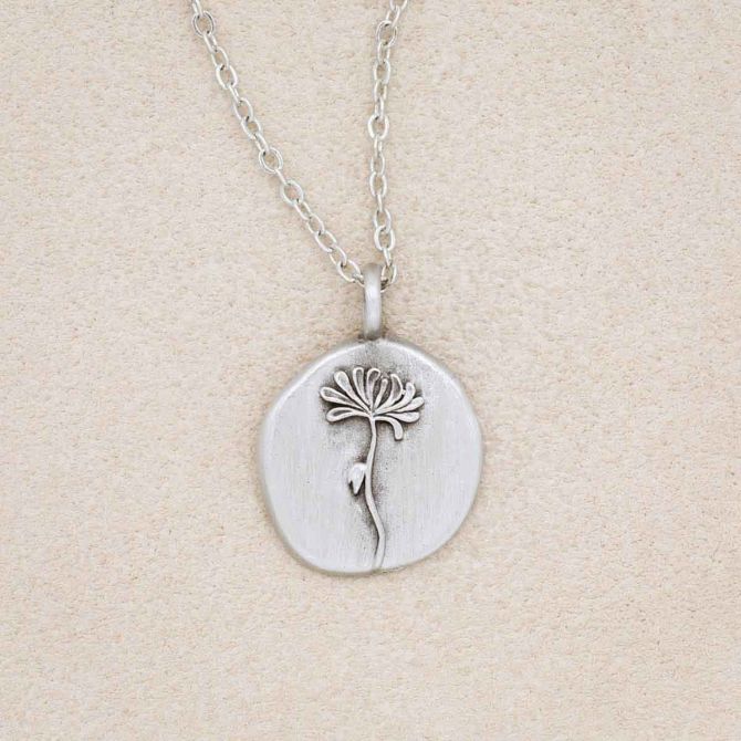 pewter November Birth Flower necklace with 18" link chain, on beige background