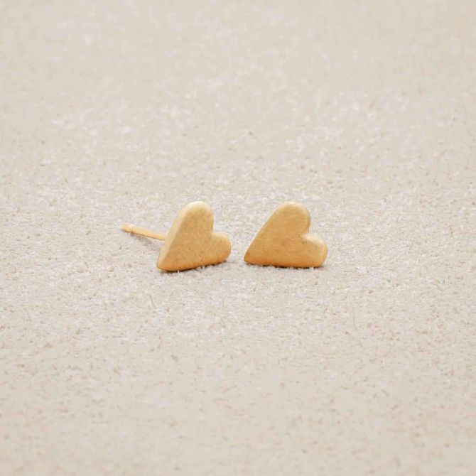 14k yellow gold tiny heart stud earrings with a matte brushed finish