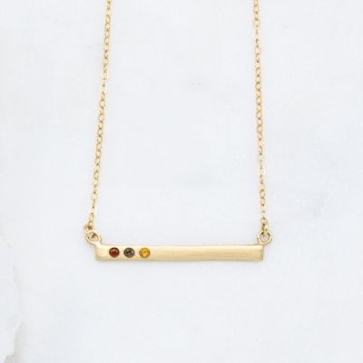 10k yellow gold cross bar birthstone necklace strung on a gold-filled link chain customizable with up to 7 genuine 2mm birthstones 