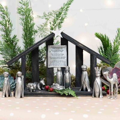 A savior is born pewter nativity set with 11 pewter pieces including Mary, Joseph, baby Jesus and his manger, three wisemen, a shepherd and handcrafted animals