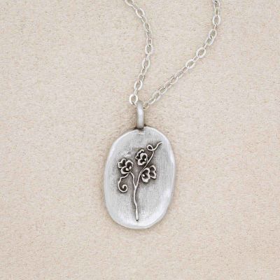 pewter April Birth Flower necklace with 18" link chain, on beige background