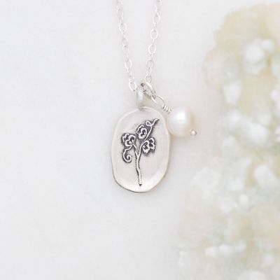 April birth flower necklace handcrafted in sterling silver with a special birth month charm strung with a vintage freshwater pearl