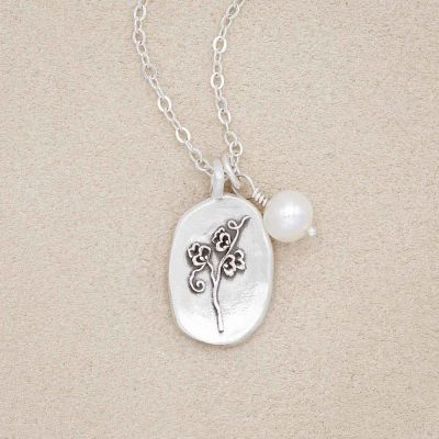 April birth flower necklace handcrafted in sterling silver with a special birth month charm strung with a vintage freshwater pearl