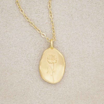gold plated August birth flower necklace with an 18" gold filled link chain, on beige background