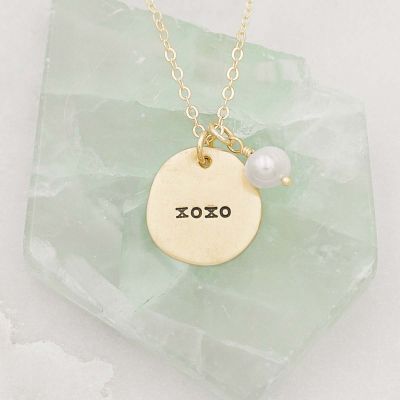 Beloved name disc handcrafted in 10k yellow gold hung with a vintage freshwater pearl and customizable with a name or word