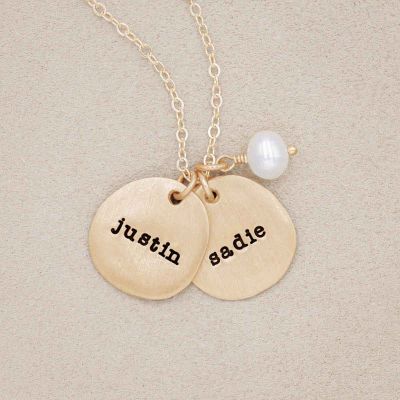 Beloved name disc handcrafted in 10k yellow gold hung with a vintage freshwater pearl and customizable with a name or word