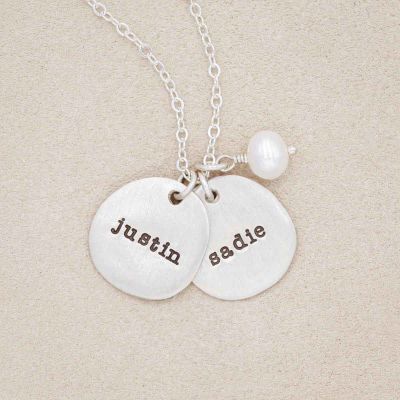 Beloved name disc handcrafted in sterling silver hung with a vintage freshwater pearl and customizable with a name or word