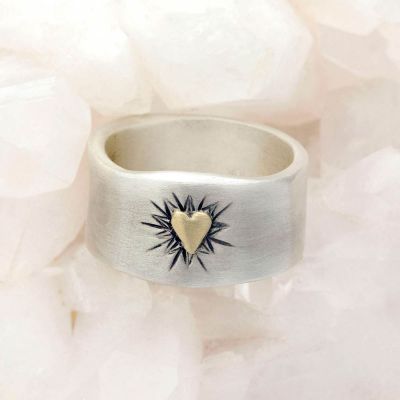 Bursting heart ring hand-molded sterling silver finished with a 10k yellow gold heart and hand-engraved with sunburst design