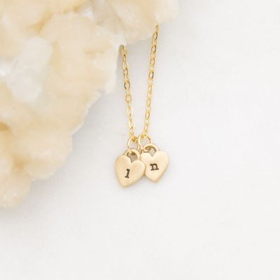 Cherished hearts initials necklace handcrafted in 14k yellow gold including two customizable sterling silver charms