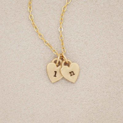 Cherished hearts initials necklace handcrafted in 14k yellow gold including two customizable charms