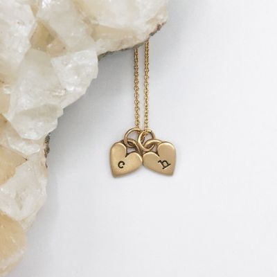 Cherished hearts initials necklace handcrafted in 10k yellow gold including two customizable sterling silver charms
