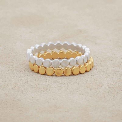Circles in a line stacking ring handcrafted in yellow gold-plated sterling silver with a satin finish 