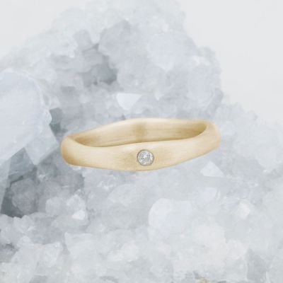 Classic stacking ring hand-molded and cast in 10k yellow gold with a 2mm birthstone or diamond 