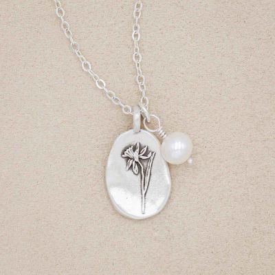 December birth flower necklace handcrafted in sterling silver with a special birth month charm strung with a vintage freshwater pearl