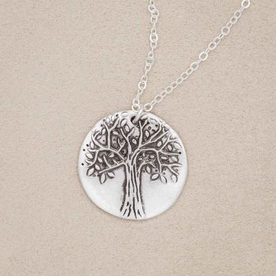Family tree necklace handcrafted in sterling silver with a matte brushed finish and personalized with a quote or family name