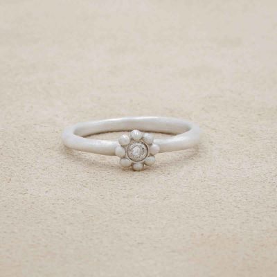 Forever flower wedding ring hand-molded and cast in sterling silver set with a 3mm birthstone or diamond