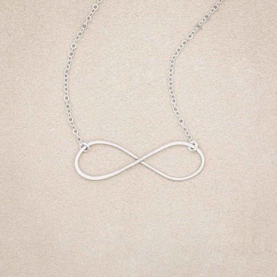 A sterling silver Forever, For Always Infinity Necklace, on beige background