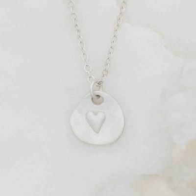 sterling silver heart charm strung on sterling silver link chain full of love necklace 