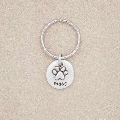 Furry Footprint keychain, handcrafted in sterling silver. Personalized key chain with pet's name
