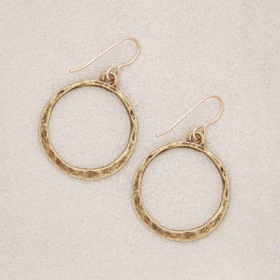 hammered hoop earrings gold plated, on suede background