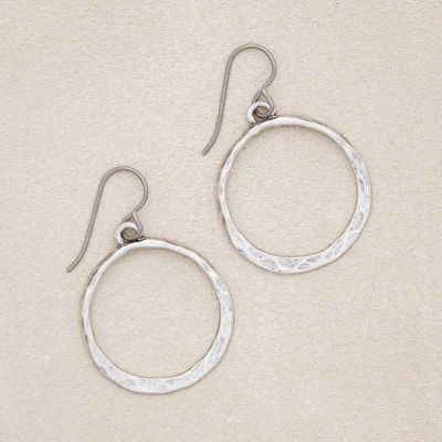 Hammered Hoop earrings, handcrafted in pewter, on a beige background