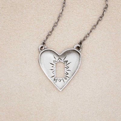 Heart wide open necklace handcrafted in sterling silver with the charm hanging on an antiqued sterling silver link chain