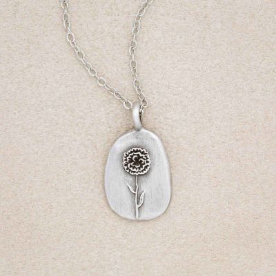 pewter January Birth Flower Necklace with an 18" link chain, on beige background