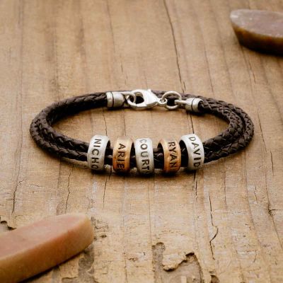 Limitless Leather bracelet handcrafted with black bolo leather cord and choice of personalized sterling silver and bronze limitless rings