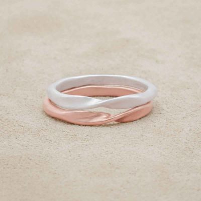 Twists and turns stacking ring handcrafted in rose gold plated sterling silver with a satin finish stackable with other mix and match rings