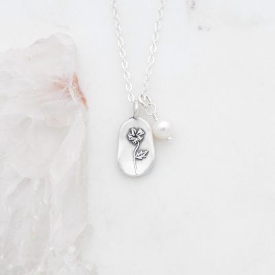 February birth flower necklace handcrafted in sterling silver with a special birth month charm strung with a vintage freshwater pearl