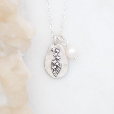 May birth flower necklace handcrafted in sterling silver with a special birth month charm strung with a vintage freshwater pearl
