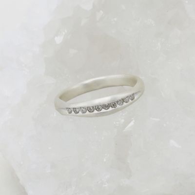 Passage ring handcrafted in sterling silver and display of 1.5mm cubic zirconias 