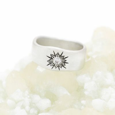 10k white gold sunburst diamond ring with a 3mm conflict free diamond 