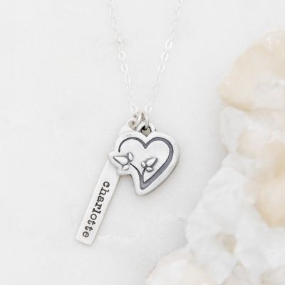 CDLS necklace handcrafted in sterling silver with a heart pendant and a sterling silver tag personalized with a special name