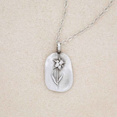 pewter March Birth Flower necklace with an 18" link chain, on beige background