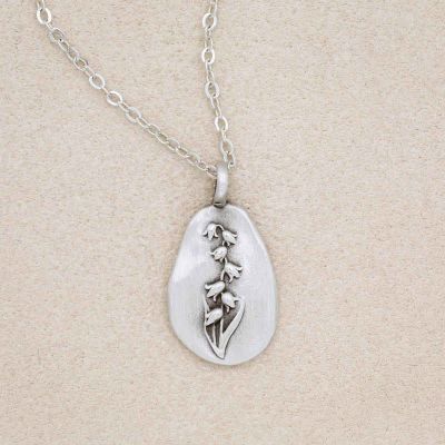 pewter May Birth Flower necklace with 18" link chain, on beige background