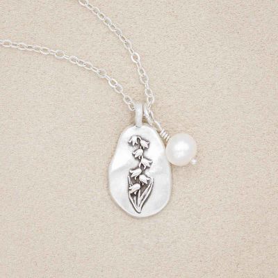 May birth flower necklace handcrafted in sterling silver with a special birth month charm strung with a vintage freshwater pearl