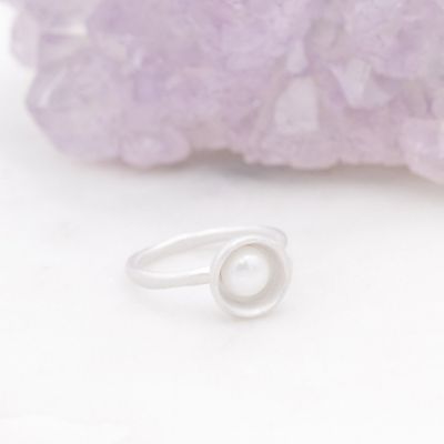 Nesting freshwater large pearl ring hand cast in sterling silver holding inside a large 6mm freshwater pearl 