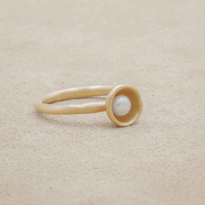 Nesting freshwater small pearl ring hand cast in 10k yellow gold holding inside a small 4mm freshwater pearl 